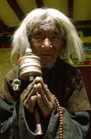 Old man with prayer wheel, Ladakh